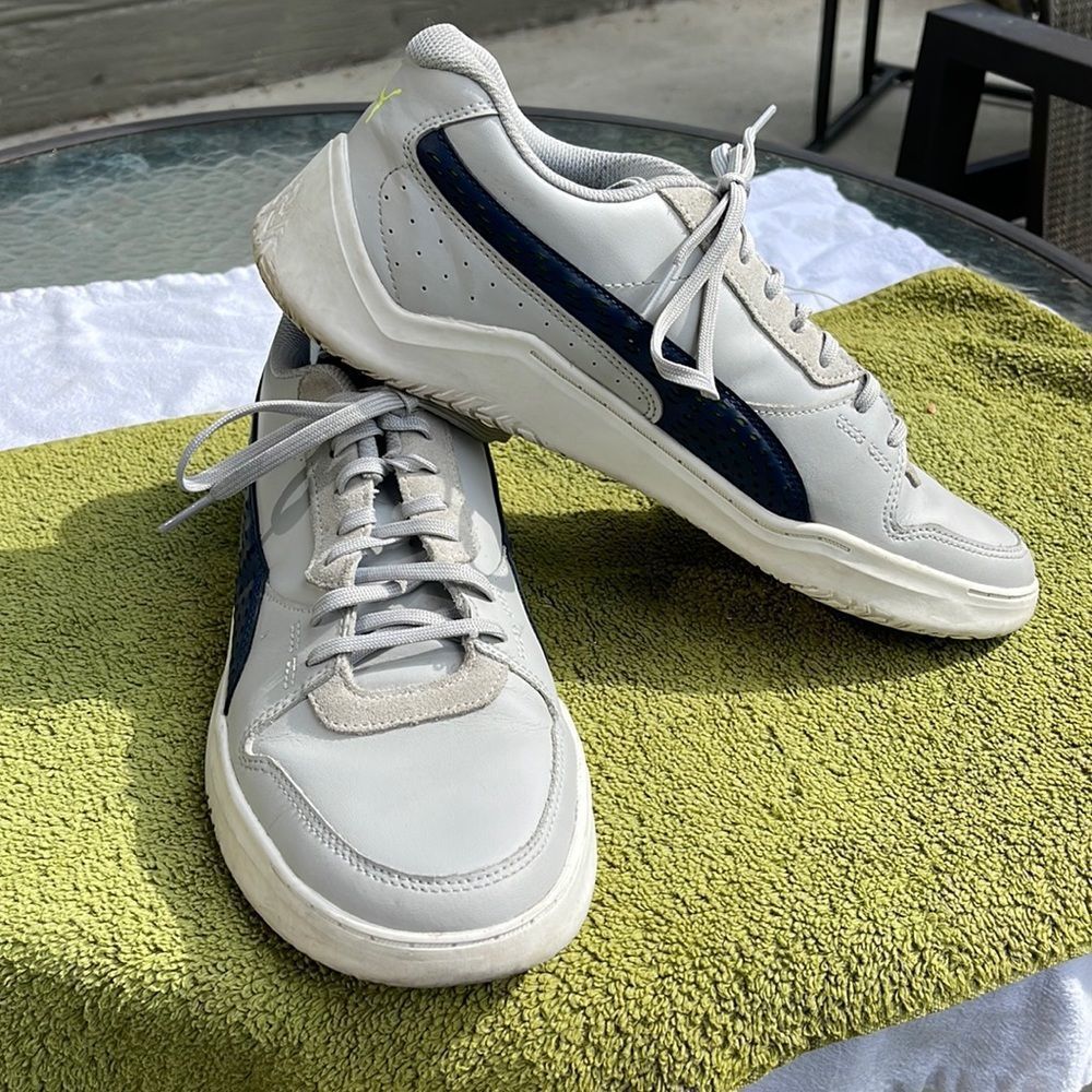 Puma men’s golf shoes size 11 good shape gray and navy blue very comfortable.